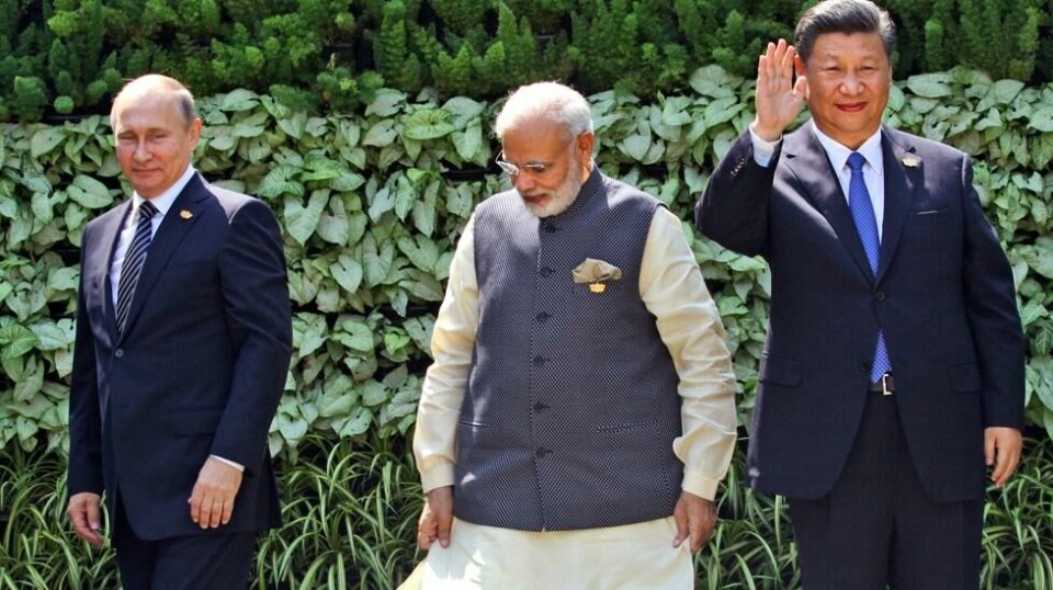 Mens Russlands president Vladimir Putin (t.v.) og Kinas leder Xi Jinping (t.h.) ønsker en utvidelse av Brics-landene, så er Indias statsminister Narendra Modi (midten) mer skeptisk til en utvidelse.