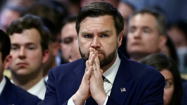 FILE PHOTO: U.S. Vice President JD Vance prays during the Good Friday Passion of the Lord service in Saint Peter's Basilica at the Vatican, April 18, 2025. REUTERS/Yara Nardi/File Photo