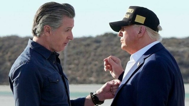 President Donald Trump talks with California Gov. Gavin Newsom after arriving on Air Force One at Los Angeles International Airport in Los Angeles, Friday, Jan. 24, 2025. (AP Photo/Mark Schiefelbein)