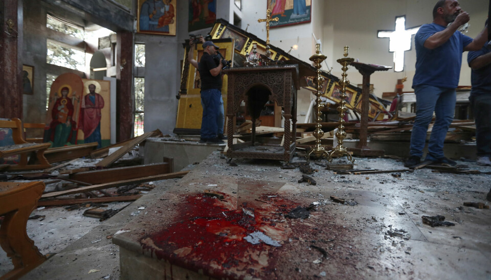 Et blodstenkt kirkegulv vitner om grufullhetene i St. Elias-kirken i Damaskus.