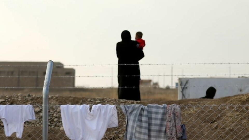 En iraksisk kvinne som flyktet fra voldshandlingene i Mosul i leiren al-Khazar torsdag denne uken.