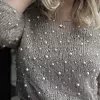 Håndstrikket mohairgenser med perler, elegant og tidløs design fra norsk strikketradisjon.