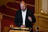 Kristján Mímir Kristjánsson står ved talerstolen i Stortinget og holder et innlegg.