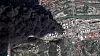 Satellittbilde av oljetanker og industriområde i brann med tett svart røyk over Tuapse.