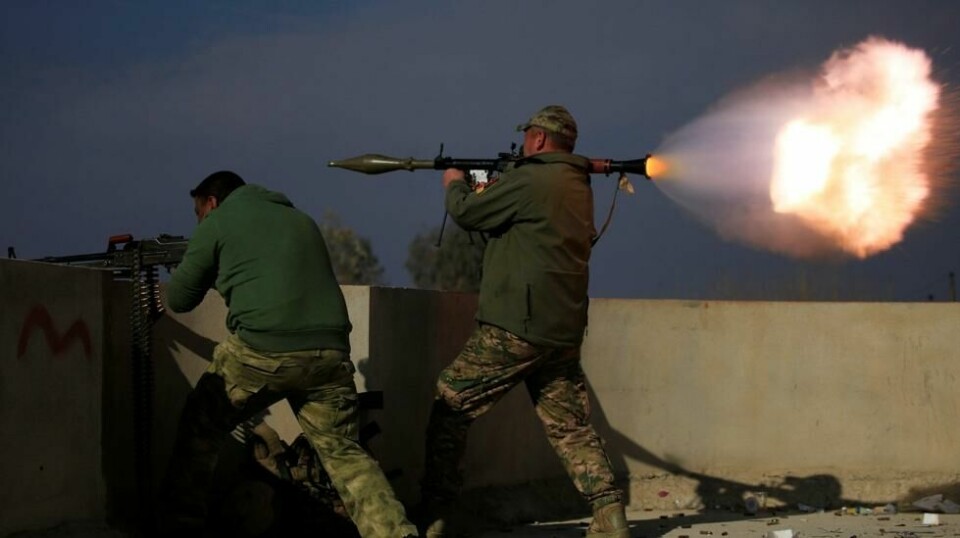 Irakiske innsatsstyrker i kamp med IS-krigere i området Yarimja sør i Mosul. 18. januar.