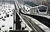 Monorail train on an elevated track above busy traffic in Cairo, Egypt.