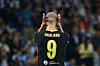 Erling Haaland sett bakfra med hendene mot hodet i Manchester City-drakt med nummer 9.