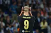 Erling Haaland sett bakfra med hendene mot hodet i Manchester City-drakt med nummer 9.