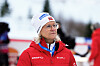 Skipresident Tove Moe Dyrhaug i rød Craft-jakke og hvit lue på ski-NM i Steinkjer.