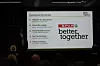Projisert presentasjon med SPAR-logoen og teksten «better together» foran et publikum.
