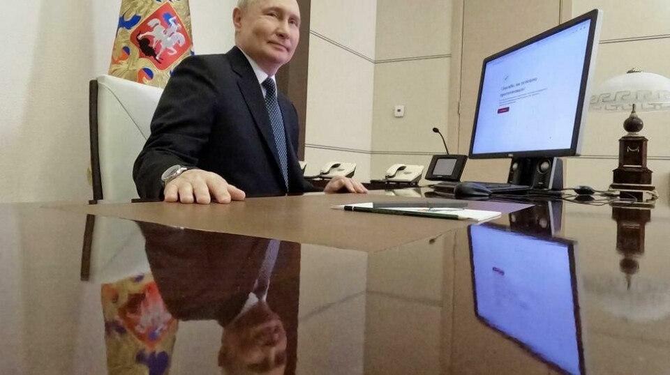Russian President Vladimir Putin attends an electronic voting during a presidential voting at the Novo-Ogaryovo state residence outside Moscow, Russia, Friday, March 15, 2024. (Mikhail Metzel, Sputnik, Kremlin Pool Photo via AP)