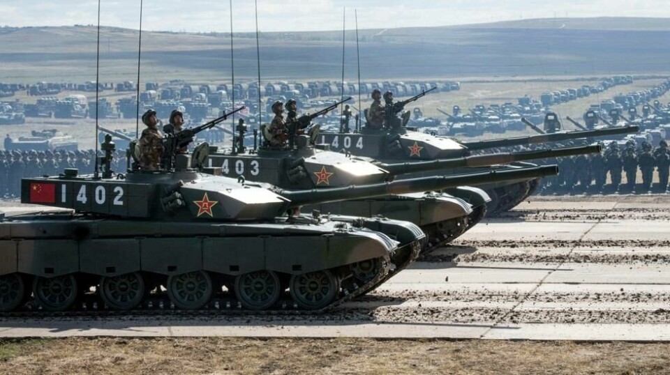 Kinesiske stridsvogner paraderer under militærøvelsene Vostok-2018 på Tsugol treningsfelt ikke langt fra grensene til Kina og Mongolia i Sibir, 13. september 2018.