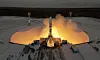 Soyuz 2.1b-rakett skytes opp fra Vostochny-kosmodromen, omgitt av flammer og snødekt terreng.