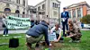 Inger Østenstad (t.v) holder et banner under en aksjon foran Stortinget, hvor Extinction Rebellion Norge gikk til sivil ulydighetsaksjon ved å plante et tre på Eidsvolls plass. Foto: Håkon Mosvold Larsen / NTB scanpix