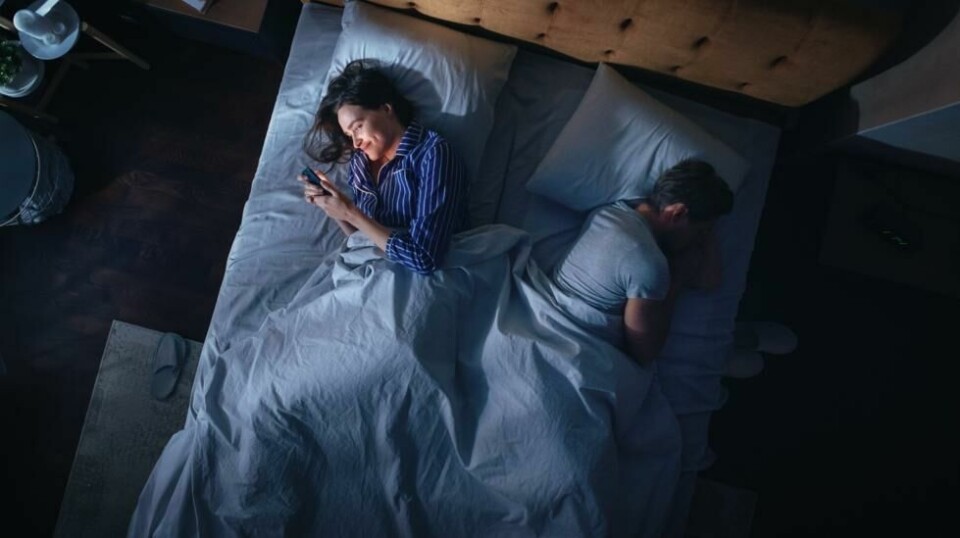 Top,View:,Young,Woman,Uses,Smartphone,In,Bed,At,Night