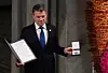 Colombias resident Juan Manuel Santos mottok Nobels fredspris for sitt arbeid for fred i landet. Foto: Tobias Schwarz / AFP