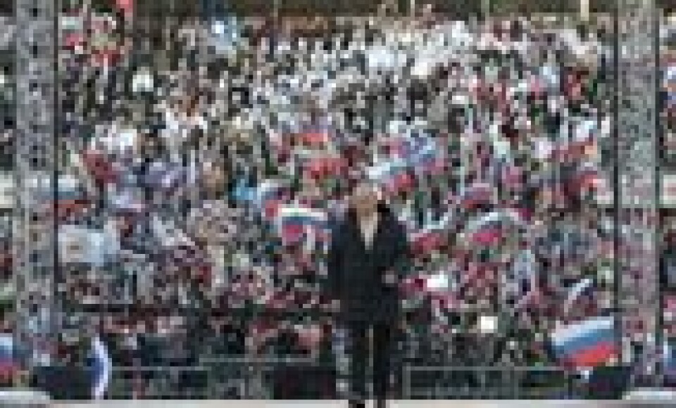 Russlands president Vladimir Putin deltar på en konsert på Luzhniki stadion i Moskva 18. mars 2022, få uker etter at invasjonen startet. Under samme arrangement ble skiløperen Aleksandr Bolsjonuv hyllet av Putin. Russlands president Vladimir Putin deltar på en konsert på Luzhniki stadion i Moskva 18. mars 2022, få uker etter at invasjonen startet. Under samme arrangement ble skiløperen Aleksandr Bolsjonuv hyllet av Putin. Foto: Mikhail Klimentyev / AFP