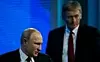 President Vladimir Putin og Kreml-talsmann Dmitrij Peskov. Foto: Maxim Shemetov / Reuters