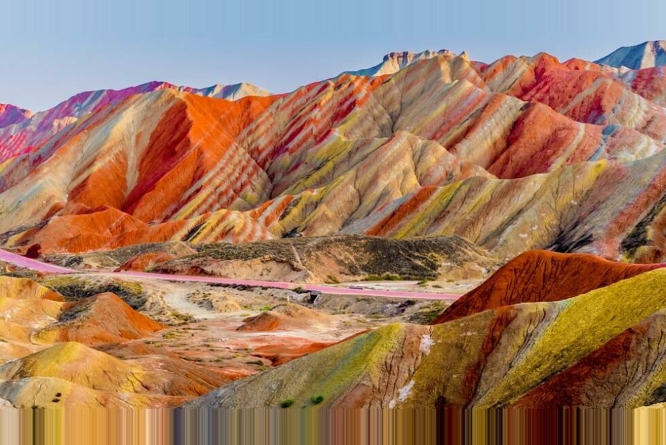 De magiske fjellene i Zhangye National Geopark i Kina er regnbuefargede. De magiske fjellene i Zhangye National Geopark i Kina er regnbuefargede. Foto: Thongchai.S / Shutterstock / NTB