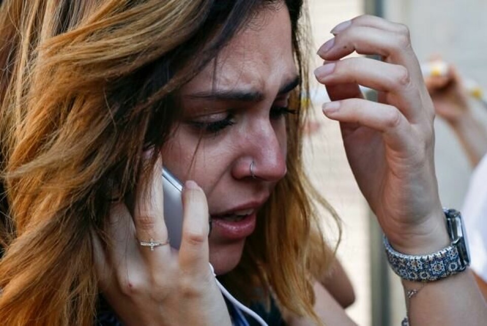 En kvinne reagerer etter at en varebil kjørte sikksak gjennom folkemengden på den berømte gågaten Rambla i Barcelona, 17. august 2017. NTB Scanpix/AFP. En kvinne reagerer etter at en varebil kjørte sikksak gjennom folkemengden på den berømte gågaten Rambla i Barcelona, 17. august 2017. NTB Scanpix/AFP.
