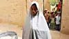 13 år gamle Hassana Mohammed klatret over et gjerde og unnslapp Boko Haram da angrepet mot skolen skjedde. Her er hun fotografert utenfor sitt hjem i Dapchi. Scanpix/AFP.