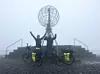 Selv om tåka skulle ligge tett og utsikten er lik null, kjennes det likevel godt å endelig komme frem til målet for alle som har syklet fra Lindesnes til Nordkapp. Foto: Magnus Fossen