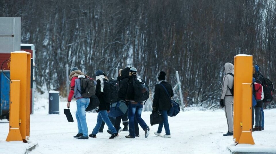 En gruppe asylsøkere på Storskog grensestasjon på den norsk-russiske grensen i november 2015.