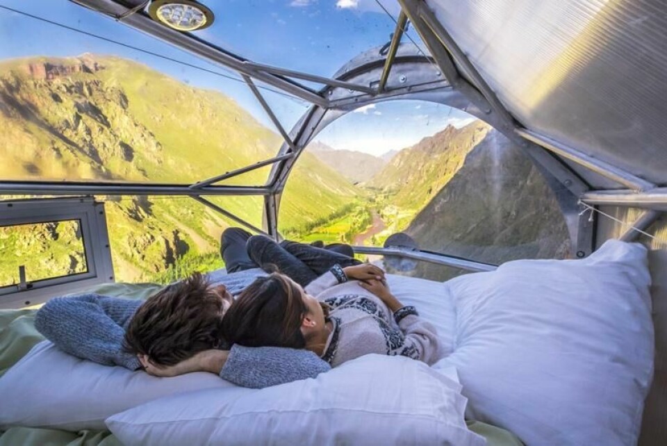 Liker du adrenalin er kanskje Skylodge Adventure Suites i Peru noe for deg. Her kan du sove i en gjennomsiktig kapsel festet til en fjellvegg. Liker du adrenalin er kanskje Skylodge Adventure Suites i Peru noe for deg. Her kan du sove i en gjennomsiktig kapsel festet til en fjellvegg. Foto: Naturavive.com / Skylodge Adventure Suites