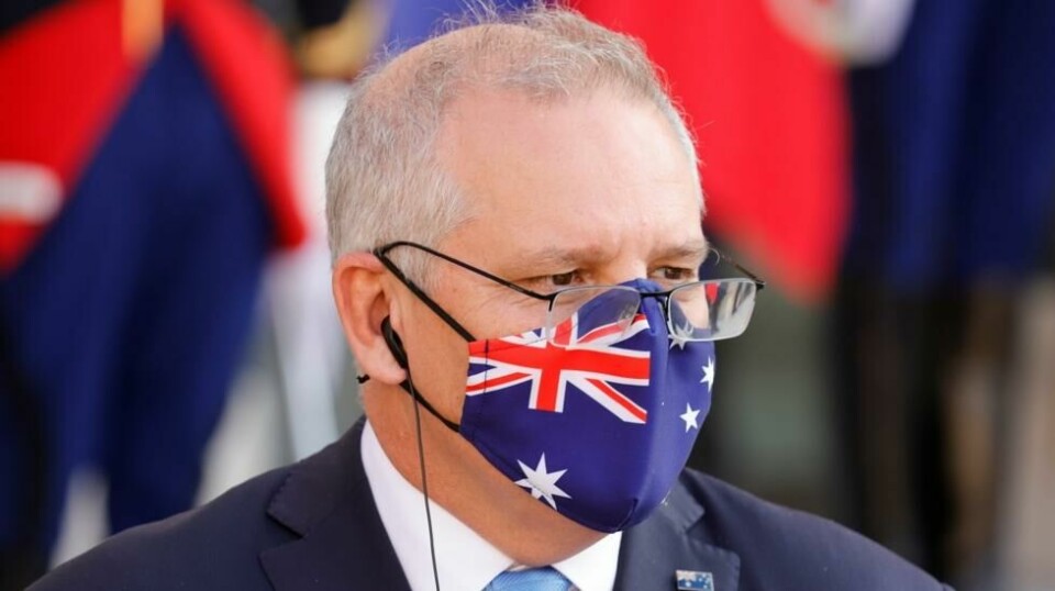 Australias statsminister, Scott Morrison, håper landet vil kunne åpne grensene i midten av 2022.