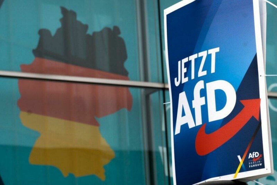 FILE —An election poster of the German far right Alternative for Germany party (AfD), right, is attached to a lamppost in front of a giant election poster showing a map of Germany, at the headquarters of the German Christian Democratic Union (CDU) in Berlin, Germany, Jan. 29, 2025. Slogan reads: 'Now AfD'. (AP Photo/Michael Sohn, File)