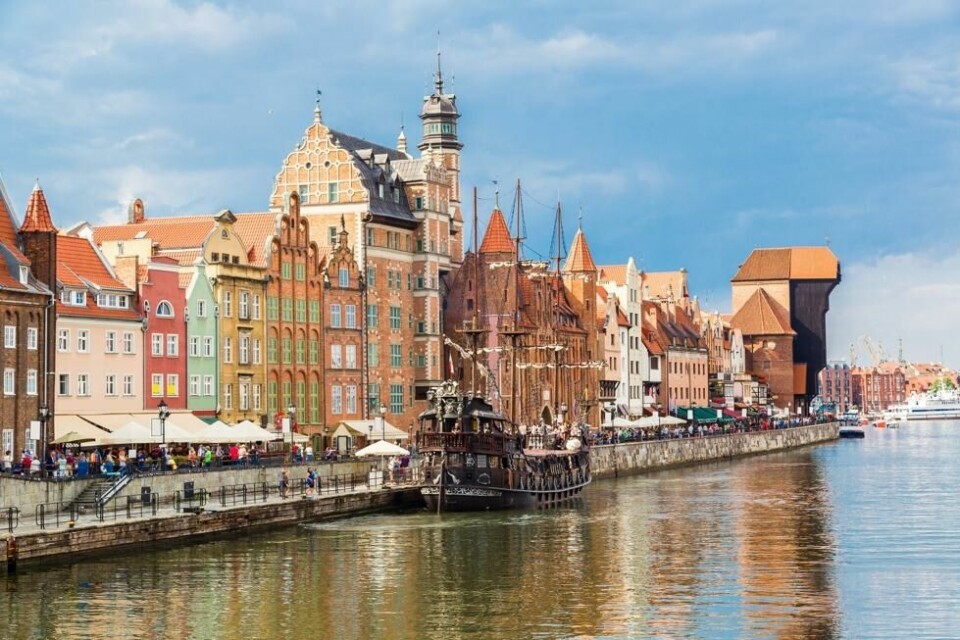 Yrende liv blant de fargerike husene ved Motlawa-elven i polske Gdansk. Yrende liv blant de fargerike husene ved Motlawa-elven i polske Gdansk. Foto: Sergii Figurnyi / Shutterstock / NTB