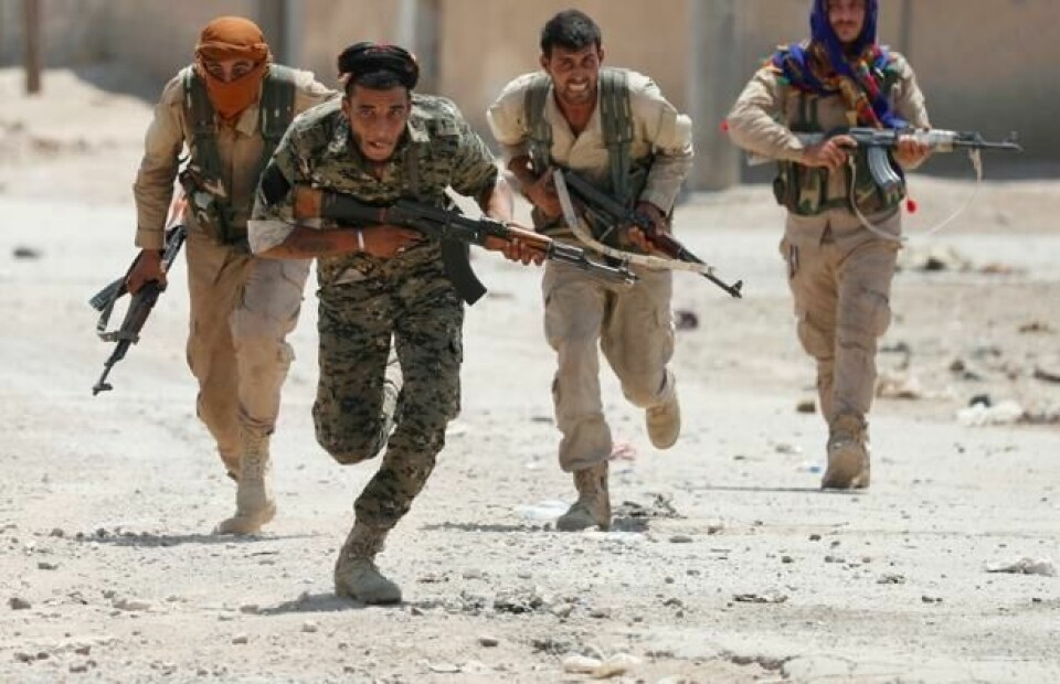 Kurdiske YPG-krigere i Raqqa under sluttoffensiven mot IS. Syria 3. juli 2017. NTB Scanpix/Reuters. Kurdiske YPG-krigere i Raqqa under sluttoffensiven mot IS. Syria 3. juli 2017. NTB Scanpix/Reuters.