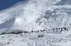 I midten av februar ble Tignes rammet av et 400 meter bredt snøskred. Fire personer omkom. Foto: Str / AFP