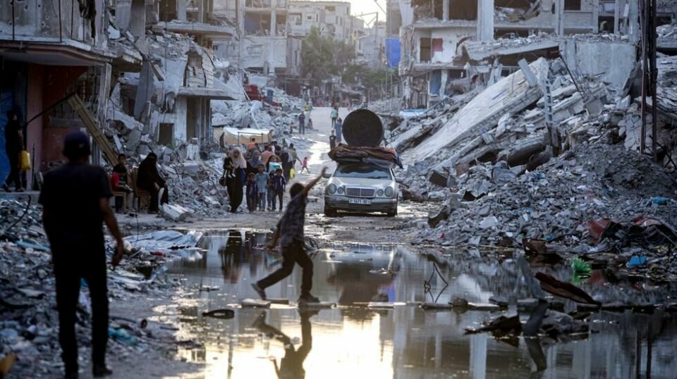 Israel Palestinians PolioFILE - Palestinians displaced by the Israeli air and ground offensive on the Gaza Strip, walk past sewage flowing into the streets of the southern town of Khan Younis, Gaza Strip, Thursday, July 4, 2024. Health authorities and aid agencies are racing to avert an outbreak of polio in the Gaza Strip after the virus was detected in the territory's wastewater and three cases with a suspected polio symptom have been reported. (AP Photo/Jehad Alshrafi, File)